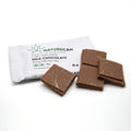 Verpakking van Naturecan CBD Chocolade met de tekst "CBD INFUSED MILK CHOCOLATE" en enkele stukjes melkchocolade.